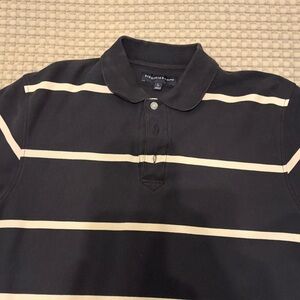 Elegant Black and Cream Striped Polo Shirt